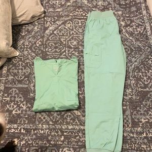 Butter soft by UA scrubs. Jade/ light blue color